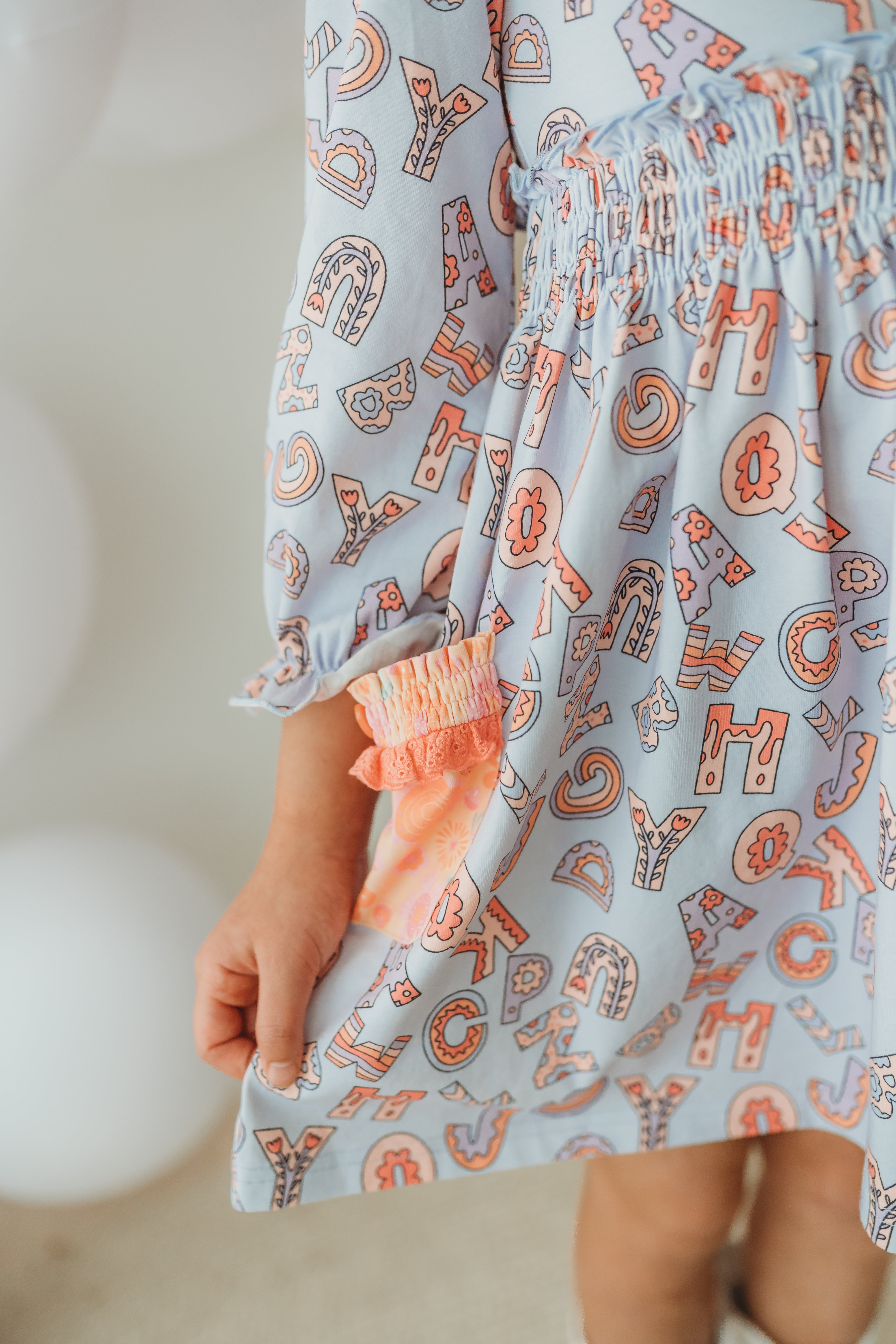 Alphabet Parade Lap Dress (Pre-Order)