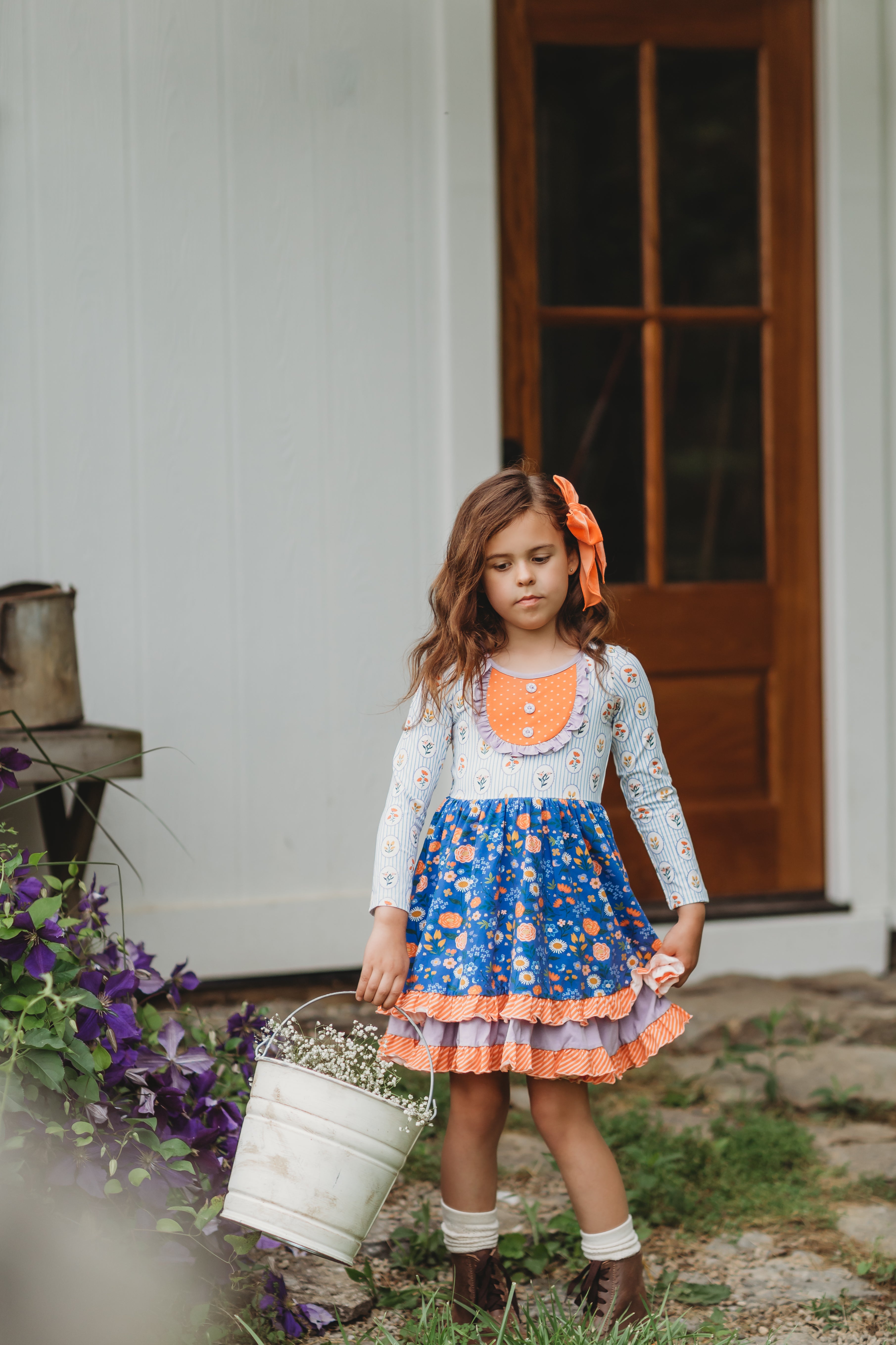 Little girl shops ruffle outfits